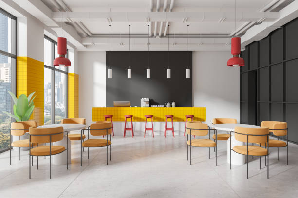istock Modern cafe interior with bright yellow and red elements, featuring a bar counter, tables, and chairs in a minimalist setting. 3D Rendering 2191823950