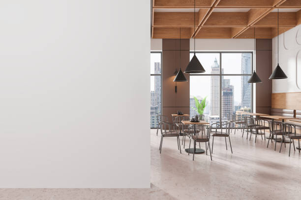 istock Cafe interior with chairs and eating tables, panoramic window. Mock up wall 2191823988