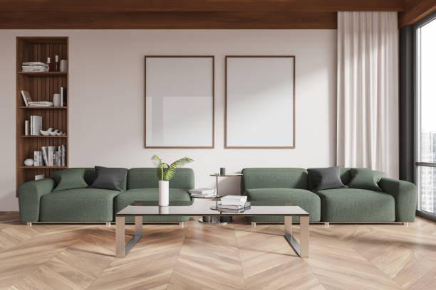 istock Living room with two blank posters on the wall above green sofas in a modern interior design setup. 3D Rendering 2191824052