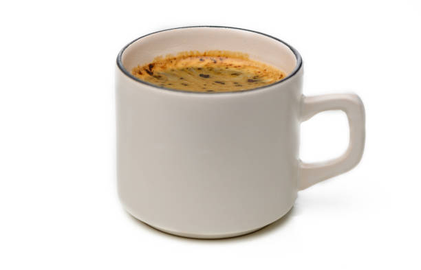 Top view, coffee and drink at table of cafe, restaurant or shop for breakfast in the morning in cafeteria. Above, mug or cup with latte, espresso or cappuccino with cream on wooden background closeup
