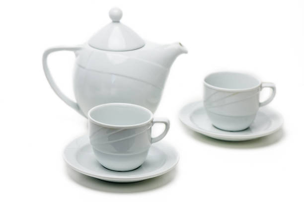 A lovely white tea set offers a tranquil space for warm brews and delightful conversations.