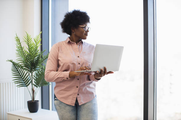 istock African American businesswoman using laptop in modern office 2191828068