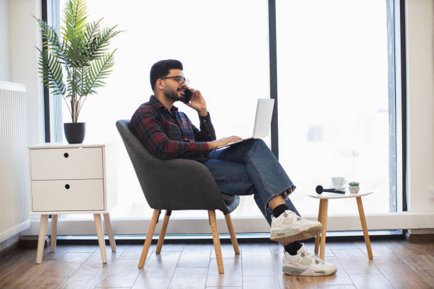 istock Young Indian man working remotely in a modern minimalist office space 2191828150