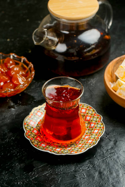 istock Refreshing tea served in a traditional glass with sweets and a teapot 2191829230