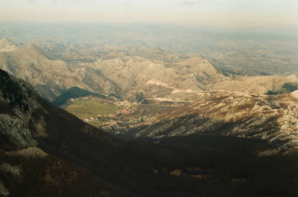 Vast mountain landscape enveloping a tranquil valley in the balkans