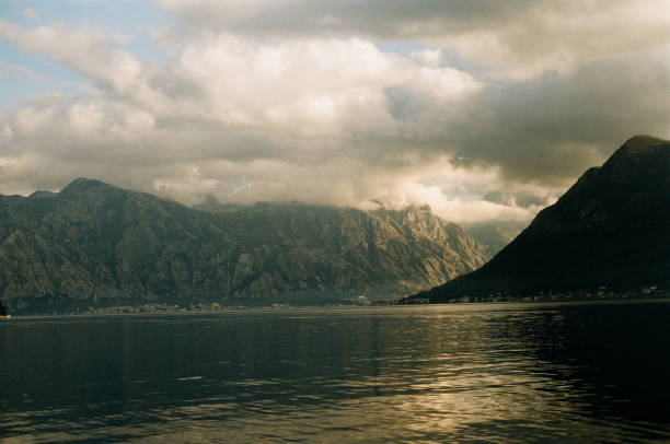 Scenic view of the bay of kotor with dramatic clouds reflecting on the water surface