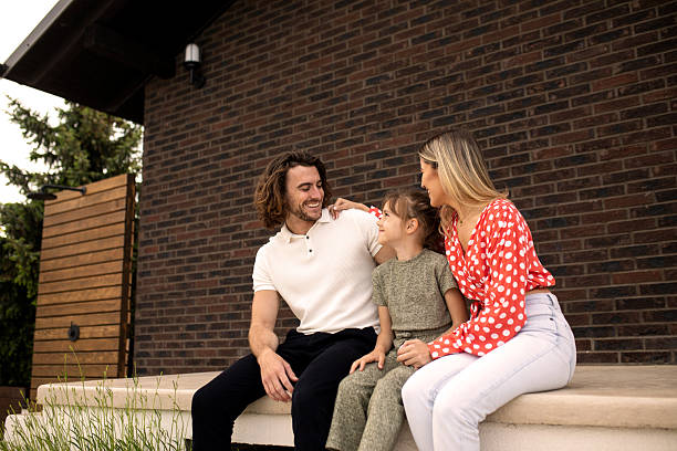 istock Young parents having fun with their daughter at the house back yard 2191836610