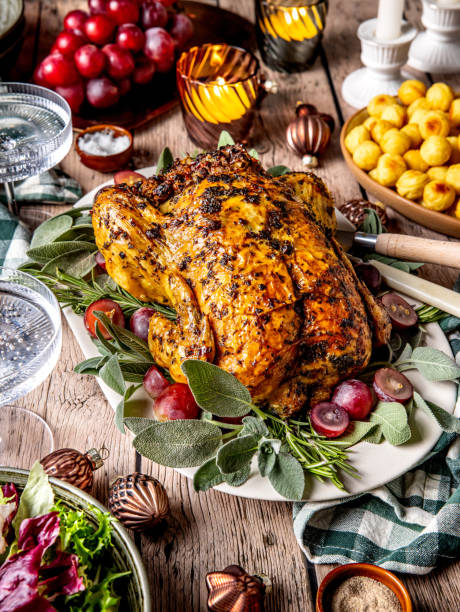 istock Festive whole roasted and stuffed chicken served on wooden table 2191840239