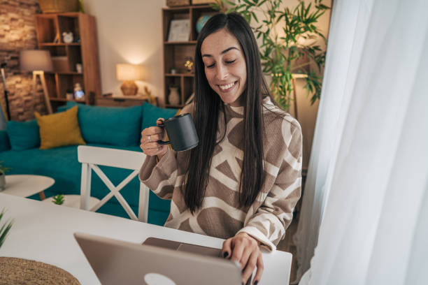 istock Beautiful woman relaxing and drinking hot tea 2191841215