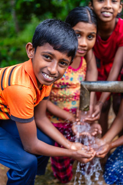 istock Sri Lankan children drinking a water, Ceylon 2191844760