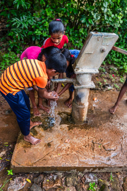 istock Sri Lankan children drinking a water, Ceylon 2191844770