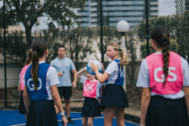 istock Australian netball team players practicing with coach guidance on routine matching in gold coast 2191845202