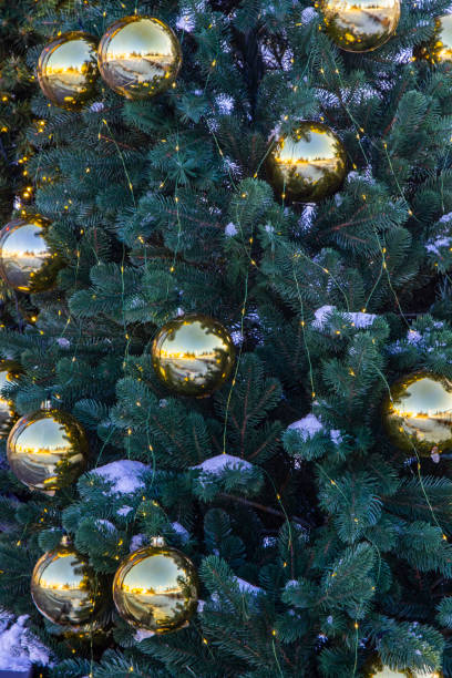 istock Golden colored balls on the Christmas tree. 2191846171
