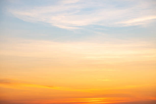istock Sky,sunset, beautiful , luxury soft gradient orange gold clouds and sunlight on the blue sky perfect for the background, Sunrise on morning or everning in winter warm time ,Twilight summer,silhouette 2191846911