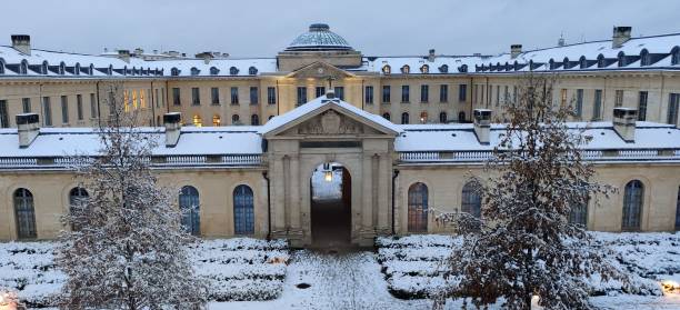 istock Historic snow-covered building with garden 2191846999