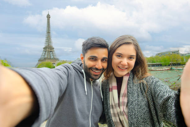 istock Smiling Couple Taking a Selfie by the Eiffel Tower in Paris 2191848237