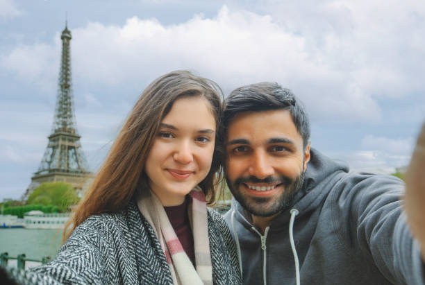 istock Smiling Couple Taking a Selfie by the Eiffel Tower in Paris 2191848272
