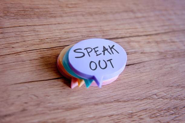 istock Colorful sticky notes shaped like speech bubbles with the phrase Speak Out written on them. 2191848748