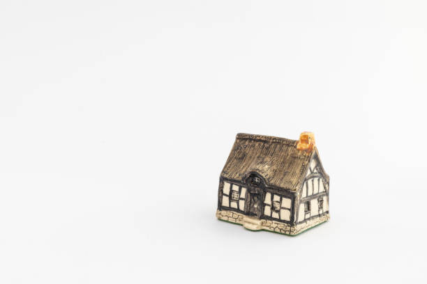 Toy ceramic house on white isolated background