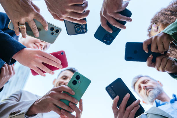 istock Group of People Holding Smartphones in a Circle 2191857376