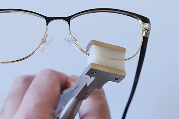 istock Thin female eyeglass metal frame eyepiece adjusted with eyewire forming plier 2191859258