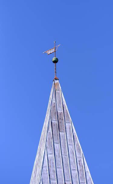 istock Church Steeple Under Clear Blue Sky Featuring Detailed Weather Vane 2191859342