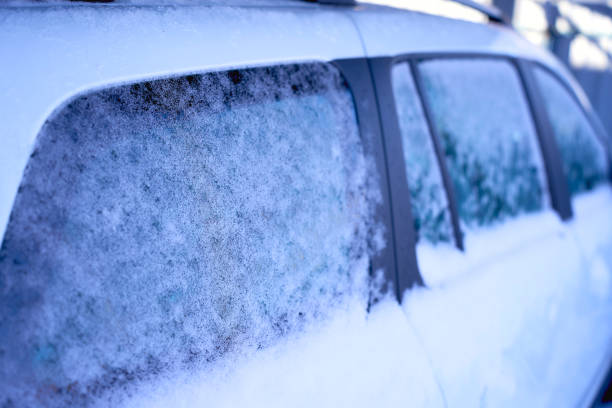 istock white car is covered with ice and snow 2191859526