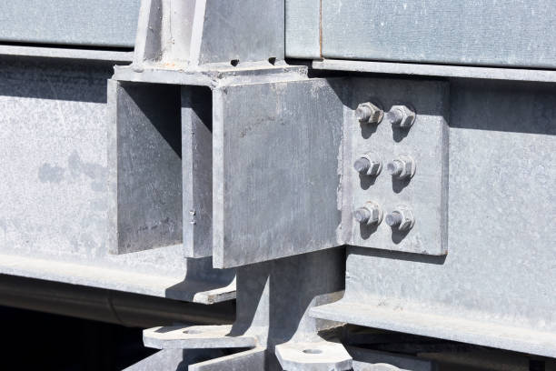 istock Structural node of a new prefabricated structure, steel carpentry with pillars, steel beams and galvanized steel bolts with bolted metal plates 2191861054