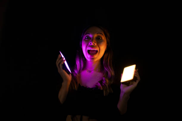 istock colors latina woman posing on camera with black background 2191861720