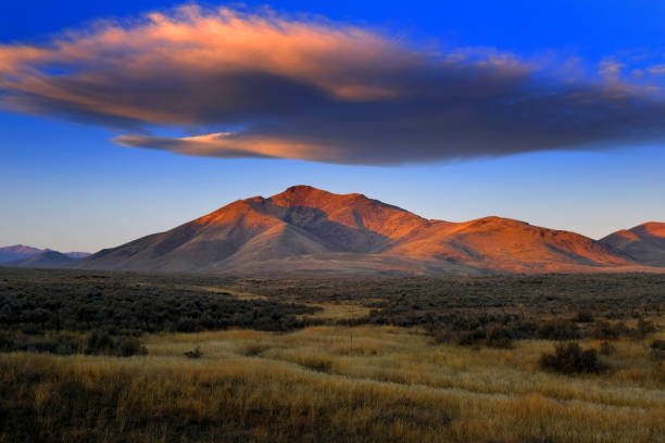 istock Sunset or Sunrise on Mountain with Cloud in Sky 2191861976