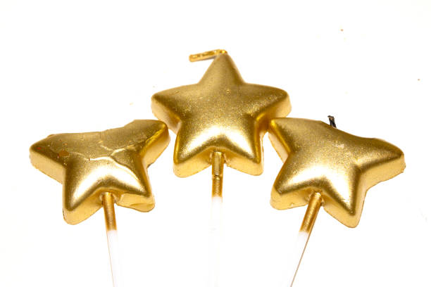 istock Party Over Gold Candle Star Shaped Melting On White Background Celebration 2191862424