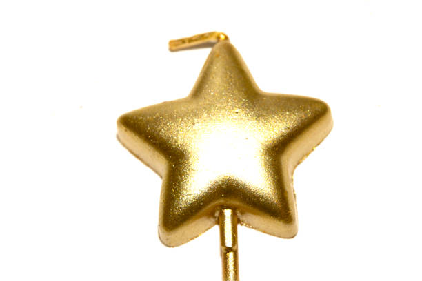 istock Party Over Gold Candle Star Shaped Melting On White Background Celebration 2191862457