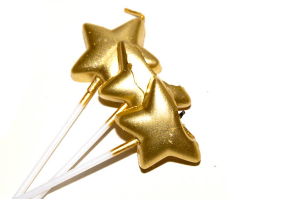 istock Party Over Gold Candle Star Shaped Melting On White Background Celebration 2191862523