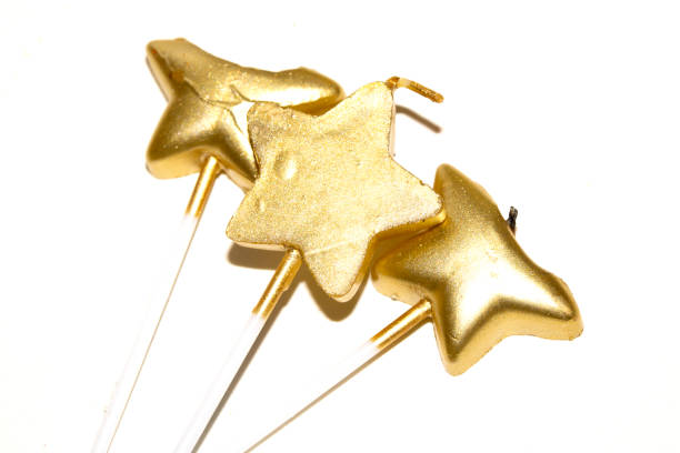 istock Party Over Gold Candle Star Shaped Melting On White Background Celebration 2191862525