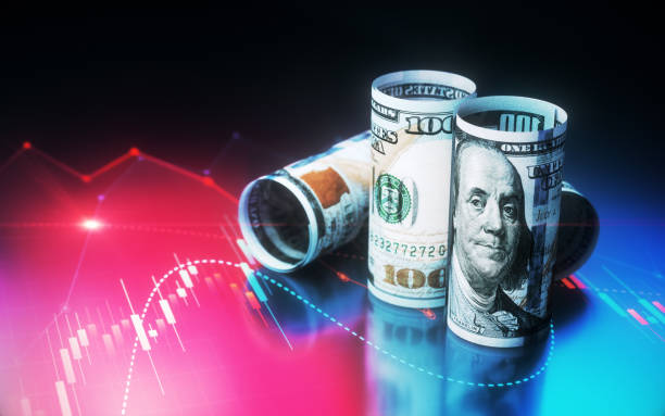 istock $100 Rolling Bills on Red and Blue Financial Chart, Depth Of Field 2191863716