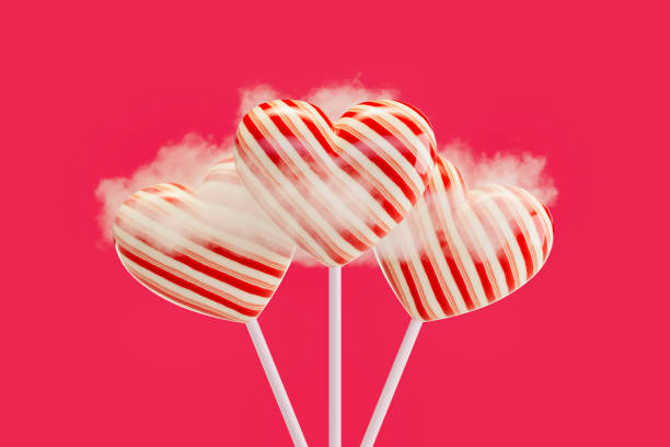 istock Valentine's Day, heart shaped lollipop on pink background 2191867254