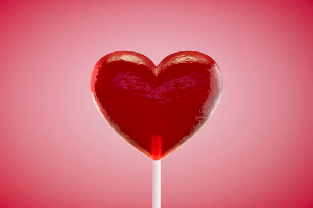 istock Valentine's Day, heart shaped lollipop on pink background 2191867469
