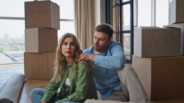 istock Exhausted spouses moving apartment feeling stress. Fatigued homeowners rest 2191867947