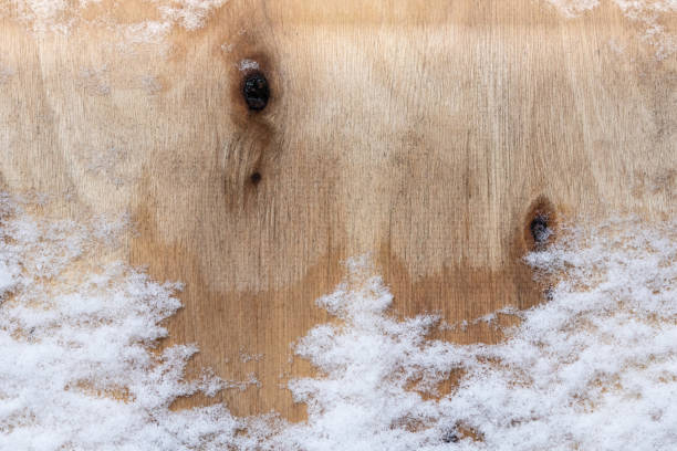 istock Wooden background covered with snow 2191871633