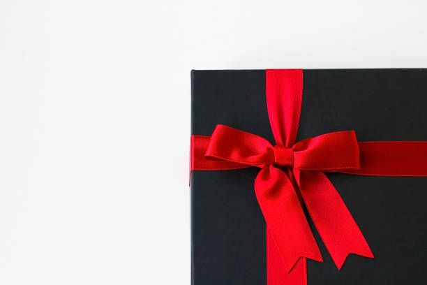 istock A black gift box with red ribbon 2191871944