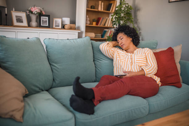 istock Multiracial woman napping in living room 2191872740