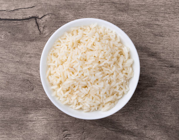 istock Cooked white rice in a bowl over wooden table 2191872970