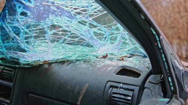 istock Damaged Wrecked Car with Shattered Windshield from Road Accident Scene 2191876042