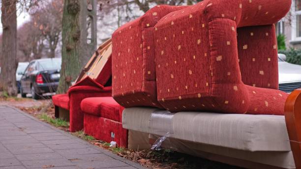 istock Old Unwanted Furniture Couch Dumped on Sidewalk on Bulk Garbage Collection Day for Curbside Pickup by City Cleaning Services 2191876109