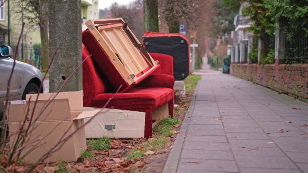 istock Old Unwanted Furniture Couch Dumped on Sidewalk on Bulk Garbage Collection Day for Curbside Pickup by City Cleaning Services 2191876138