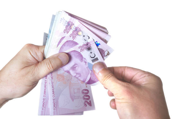 istock Human hand counting 200 TL banknotes on white isolated background 2191889048