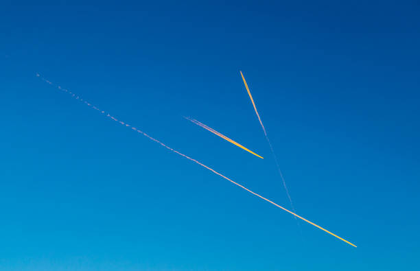 Airplane leaving a trail in a blue sky