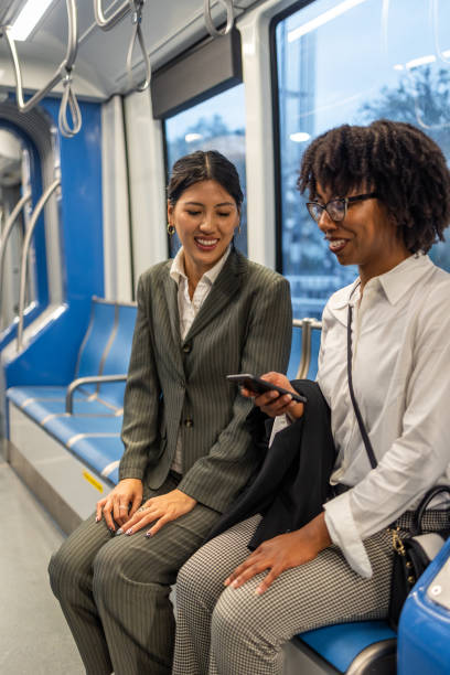 istock Two business women commuting and networking on train in Houston 2191890767