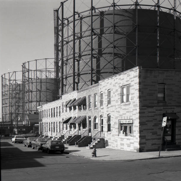 istock Row Homes with Oil tanks in Background 2191902539