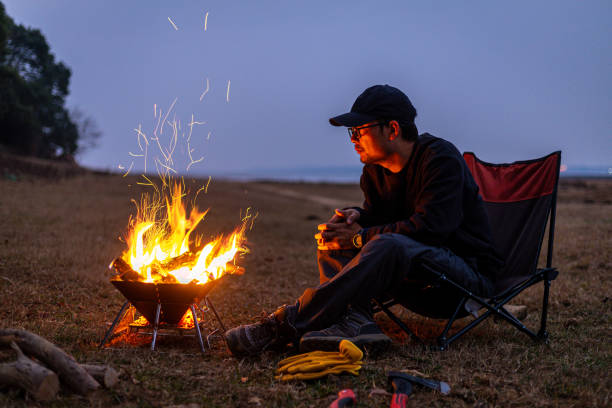 istock A Chinese man and a camping bonfire outdoors 2191902681